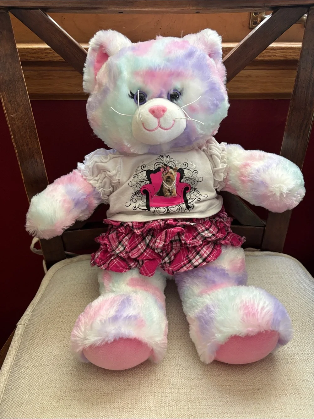 Build-A-Bear outfit featuring a graphic dog tee and a pink plaid ruffled skirt.